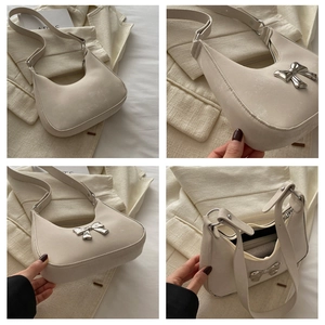 Detail shots of off-white bow hobo bag with silver metallic accents and zip closure
