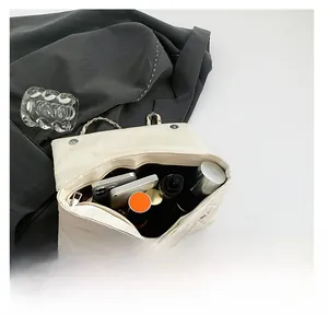 Internal view of the white quilted crossbody bag showing large capacity for essentials