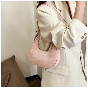 Pink crescent moon bag with marble texture finish and delicate shoulder strap detail