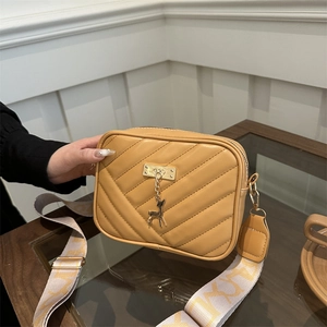 Ginger yellow crossbody camera bag with V-quilted pattern and jacquard wide strap