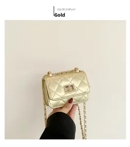 Close-up of gold quilted mini bag with metallic chain strap and twist-lock closure
