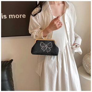 Elegant black silk handbag with pearl butterfly pattern and golden metal handle