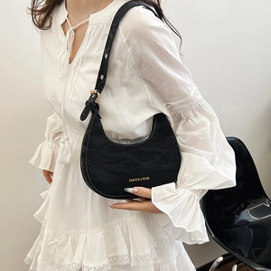 French style black crescent hobo bag with pleated texture and adjustable shoulder strap