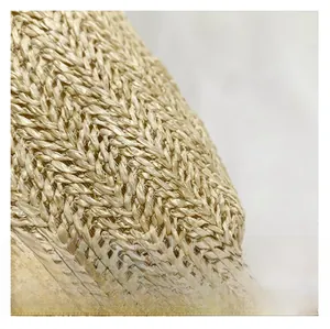 Close-up of tight raffia weave texture and premium straw material on summer tote bag