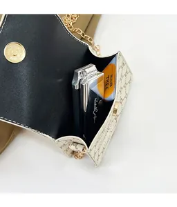 Detail view of the beige monogram shoulder bag showing internal storage capacity