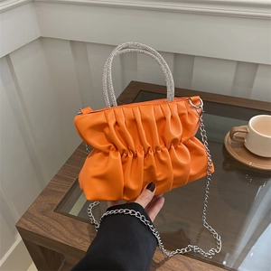 Fashionable bright orange pleated crossbody bag with rhinestone handle and chain strap