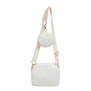 White PU leather crossbody bag with heart embossed pattern and round coin purse