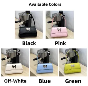 Detailansicht der Schmettelings-Tasche in den Farben Schwarz, Rosa, Beige, Blau und Grün
