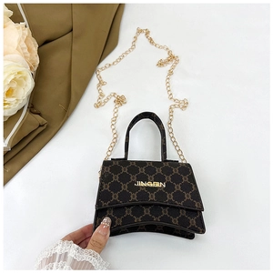 Detail of dark brown mini crossbody bag with gold JINGPIN logo and monogram texture