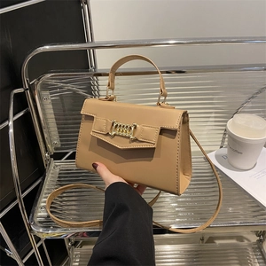 Minimalist beige rectangular crossbody bag with golden chain detail and top handle
