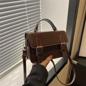 Vintage dark brown textured square handbag with gold buckles and adjustable strap