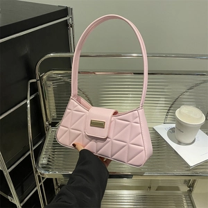 Pink quilted baguette shoulder bag with geometric stitching and luxury metal buckle
