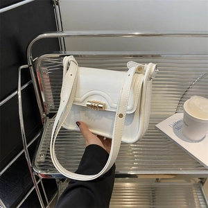 Minimalist white leather crossbody bag with a sleek gold metal buckle lock for daily commute