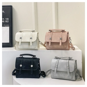 Matrix display of fashion mini crossbody bags in white, pink, black, and silver metallic