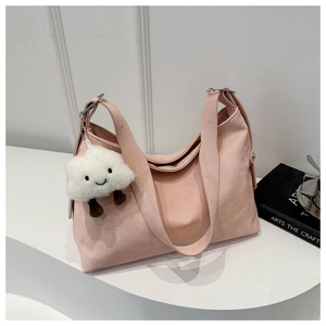 Pink soft matte leather hobo tote bag with cloud plush pendant and wide shoulder strap