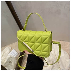 Lime green quilted crossbody bag featuring silver metal trim and elegant top handle