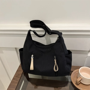 Black canvas hobo shoulder bag with double zipper pockets and large capacity design
