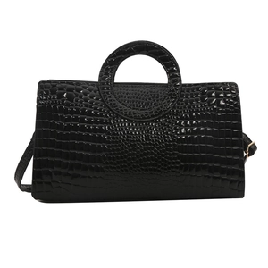 Fashionable black crocodile embossed handbag with circular ring handle and shoulder strap