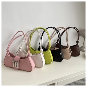 Minimalist baguette shoulder bags in six colors with metallic M logo and knotted straps