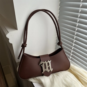Brown half-moon underarm bag with silver gothic W buckle and knotted double straps
