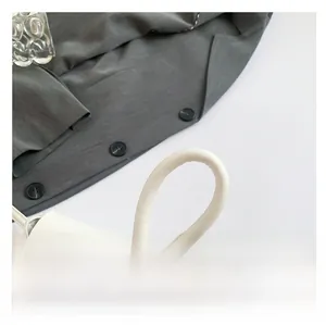 Detailed close-up of smooth white PU leather shoulder strap with neat stitching