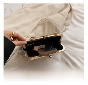 Detail view of gold-rimmed vintage embroidery bag showing interior storage capacity