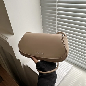 Minimalist beige shoulder bag with Fashion embossed logo and chic leather texture