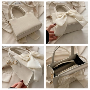 Detailed views of beige bow handbag with interior compartments and adjustable strap
