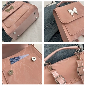 Macro details of pink butterfly backpack showing silver hardware and marble PU texture