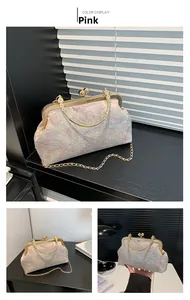 Pink jacquard square bag with retro gold kiss-lock clasp and chain strap detail