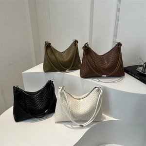 Vintage woven tote bags in four colors displayed on stairs with hobo crescent shape