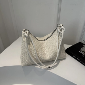Chic white woven leather tote bag with elegant shoulder straps for modern women's fashion