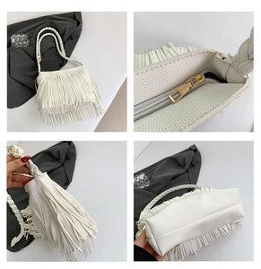 Detail view of white fringe bag with lychee grain faux leather and braided handle