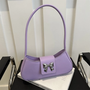Lavender underarm bag with silver metal bow accent and smooth faux leather finish