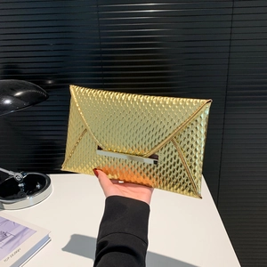 Elegant gold metallic envelope clutch bag with textured scales and pale gold metal bar