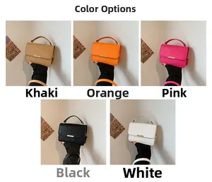 Detail showing five colors of crocodile pattern textured small square handbags with gold metal bars