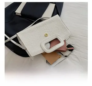 Top view of white crocodile pattern tote bag showing interior space for wallet and phone