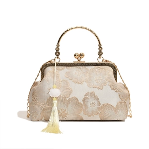 Elegant Chinese style beige floral embroidery handbag with tassels and metal frame handle