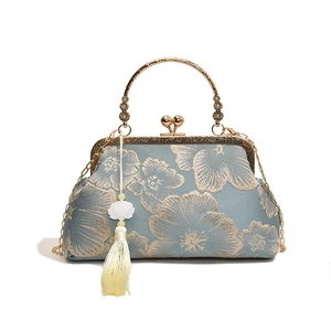 Elegant blue silk handbag with gold floral embroidery and metallic chain strap