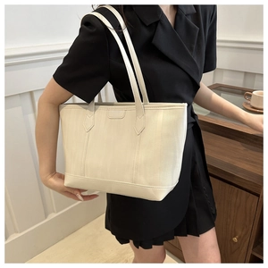 Minimalist cream white tote bag with vertical texture and sturdy double straps for daily use