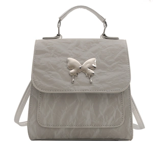 Chic light gray mini backpack with crinkled texture and silver butterfly buckle detail