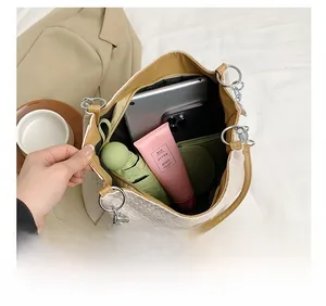 Macro view of beige woven tote bag interior showing large capacity for essentials
