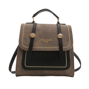 Vintage brown and black leather handbag with gold rivets and dual-use backpack straps