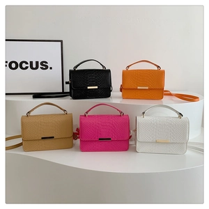 Collection of crocodile pattern crossbody bags in five colors with gold metal locks
