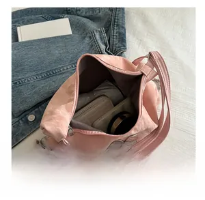 Top-down detail of pink tote bag interior showing large capacity for daily essentials