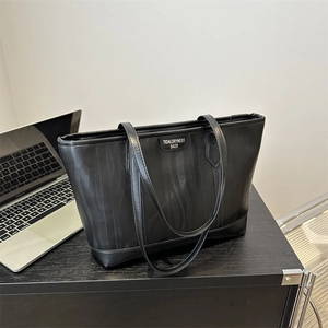 Minimalist black zebra texture tote bag for women showing large capacity commuter style