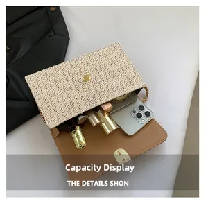Interior view showing the large capacity for phone and cosmetics in the woven straw bag