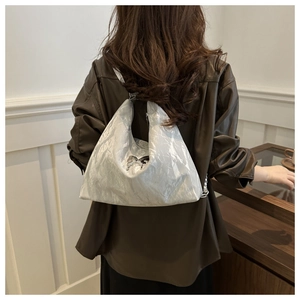 Silver wrinkled tote bag with butterfly metal pendant and chain detail on back