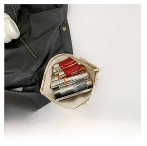 Top view of spacious canvas vanity bag showing interior storage for makeup products