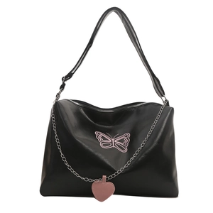 Large black tote bag featuring pink butterfly embroidery and a silver heart chain strap